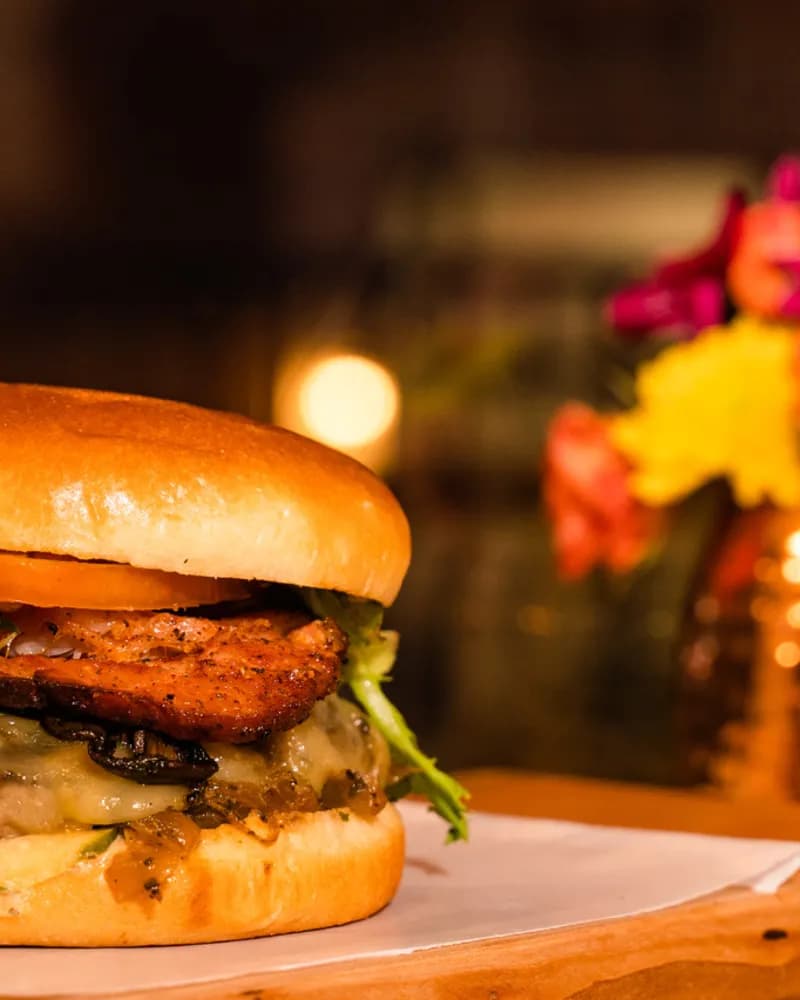 The Wonderful — a chef-driven cheeseburger loaded with 'mazin mushrooms, Havarti, house Canadian bacon, and spicy Bootstrap BBQ on a brioche bun.